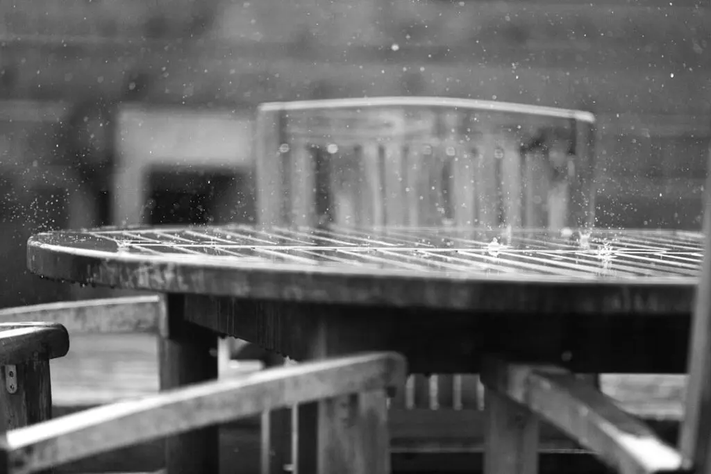 outdoor HVAC condenser unit in rain Pacific Northwest weather moisture exposure